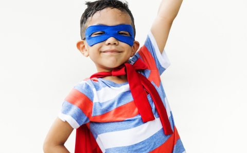 Superhero Kid Arms Raised Playful Concept